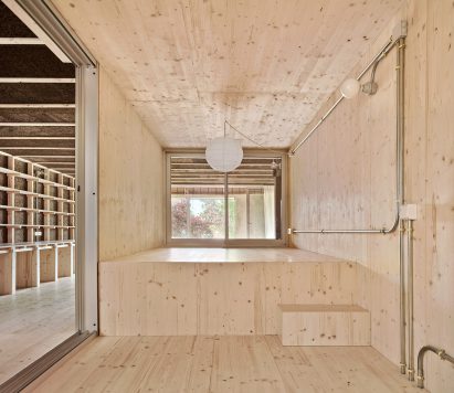 Pinewood bedroom with two levels in apartment interior by Takk