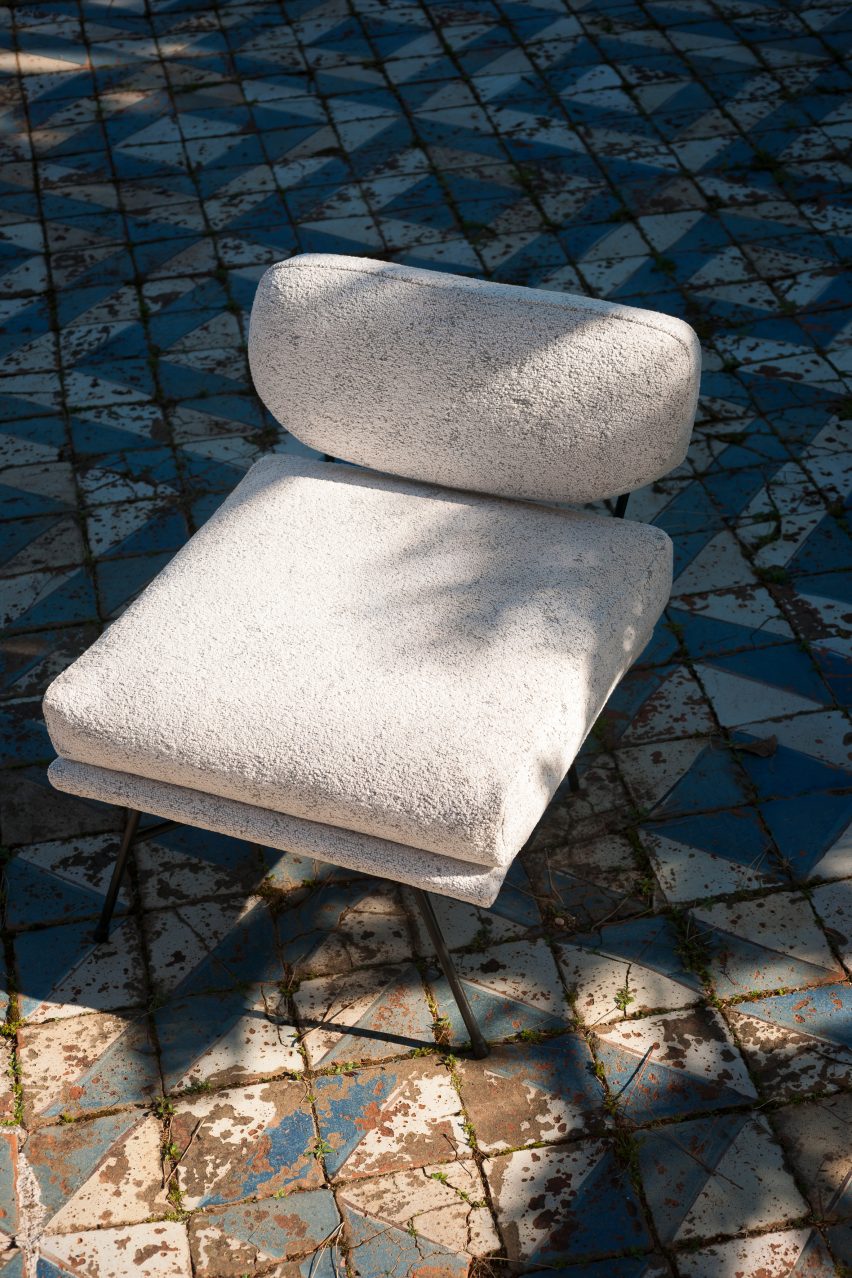 White chair on a tiled floor upholstered in Dedar Textures fabric