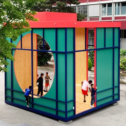 A green cubed structure with a red roof