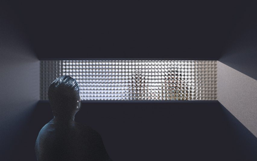 A man looks through Enter Face pavilion