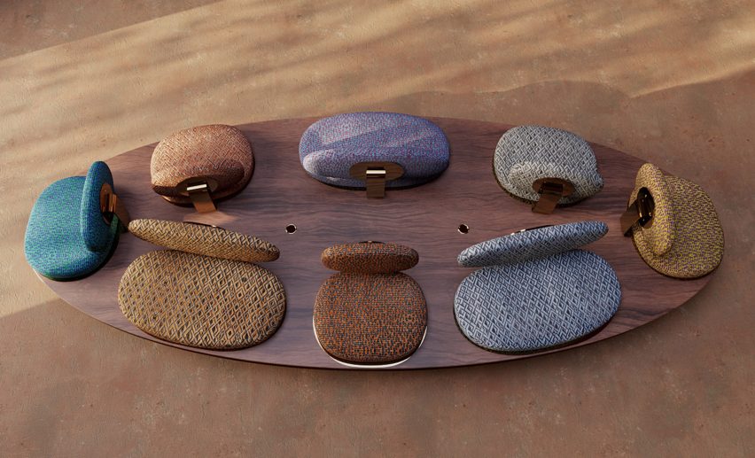 Aerial view of elliptic walnut wood sofa with pebble shaped upholstered seats