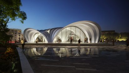 Render of the steel Dnipro Metro station lit at night