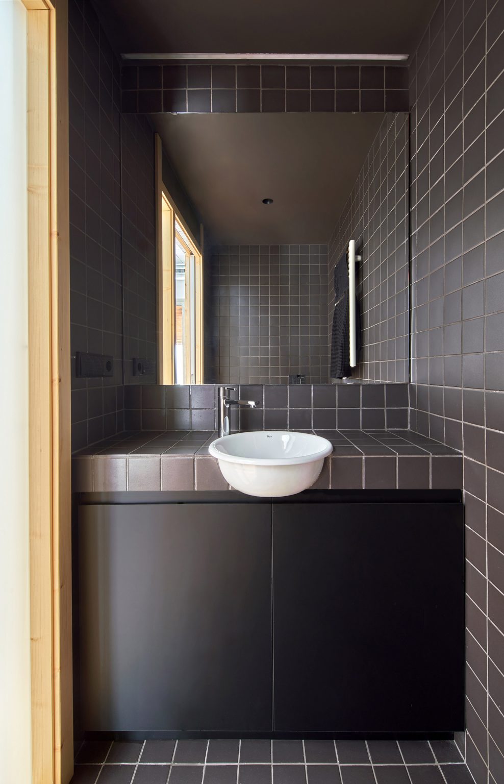 Black-tiled bathroom
