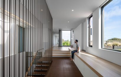 Person sitting in a modern house