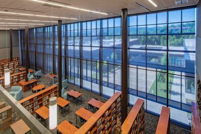 A photograph of Fayetteville High School library with large windows