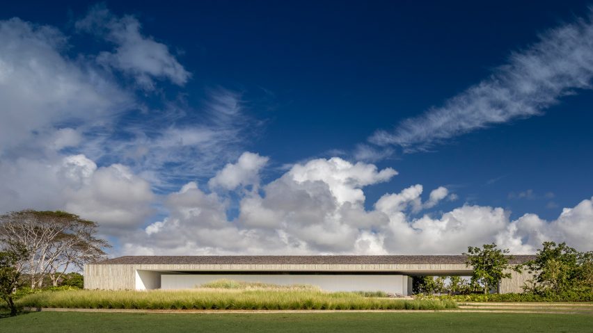 Studio MK27 nests living areas under giant roof of Brazilian beach house
