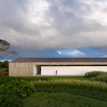 Studio MK27 nests living areas under giant roof of Brazilian beach house