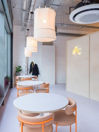 Cafe tables and chairs in entrance of ARC Club Camberwell