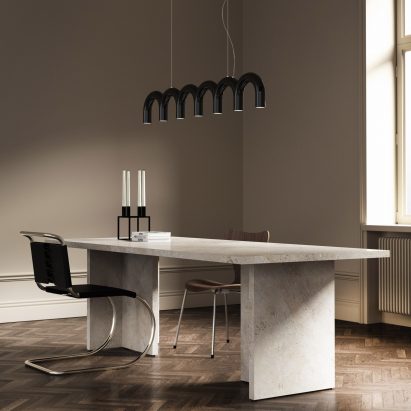 Arch pendant by Oblure in black over an office desk