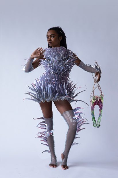 A model wearing a mini two-piece by Auroboros
