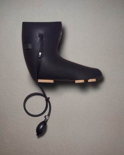 A black Adidas boot by Craig Green