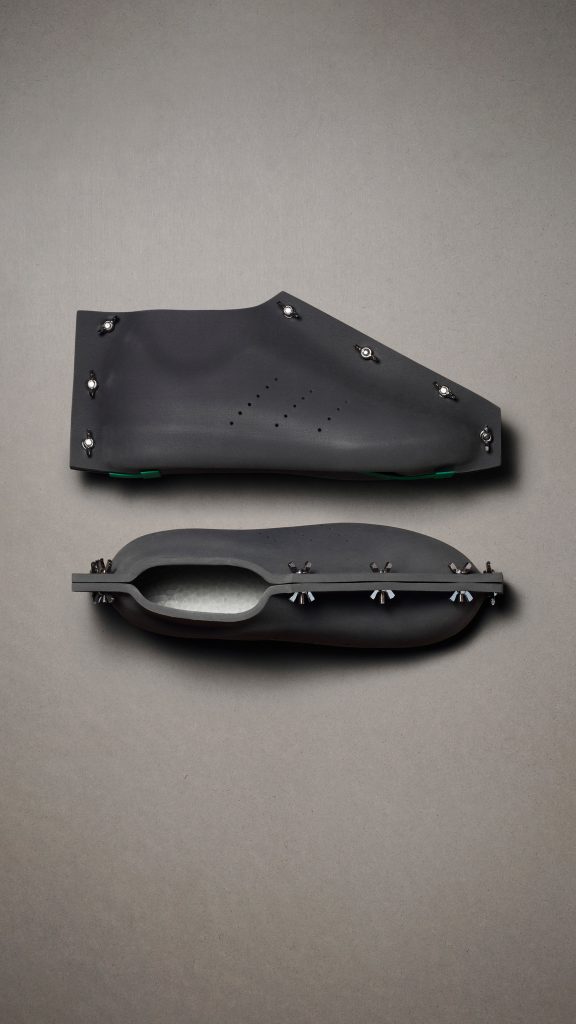 A pair of black shoes by Craig Green for Adidas