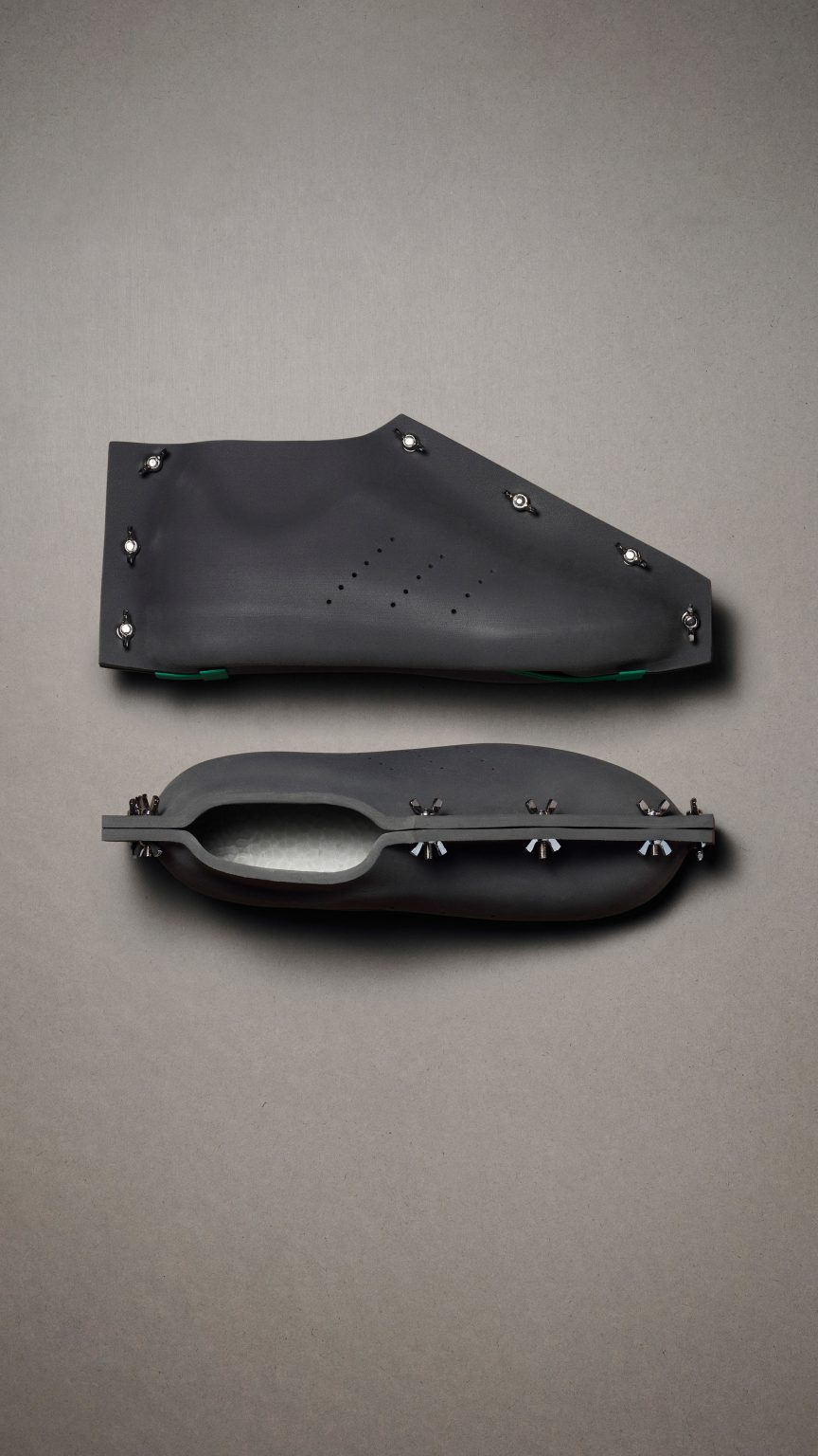 A pair of black shoes by Craig Green for Adidas