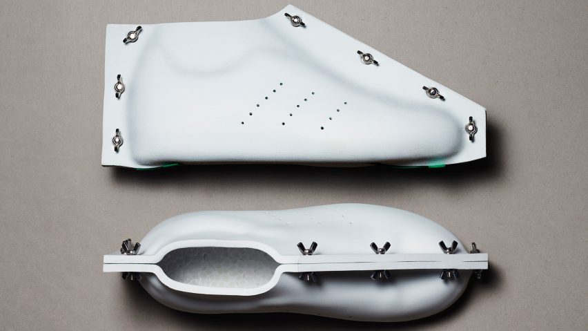 A pair of white Adidas shoes by Craig Green