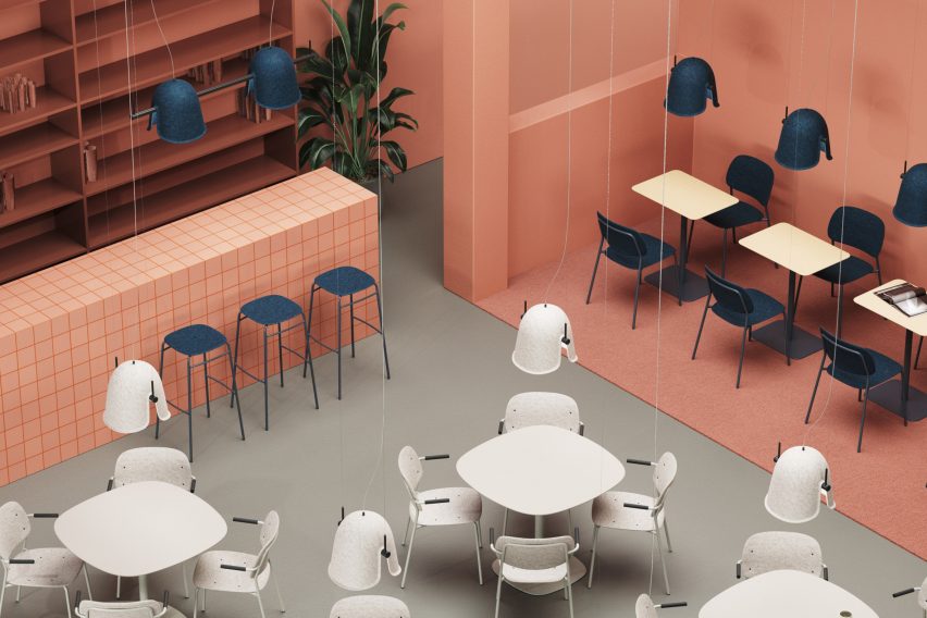 While and blue bell-shaped felt lamps hanging over a cafe interior