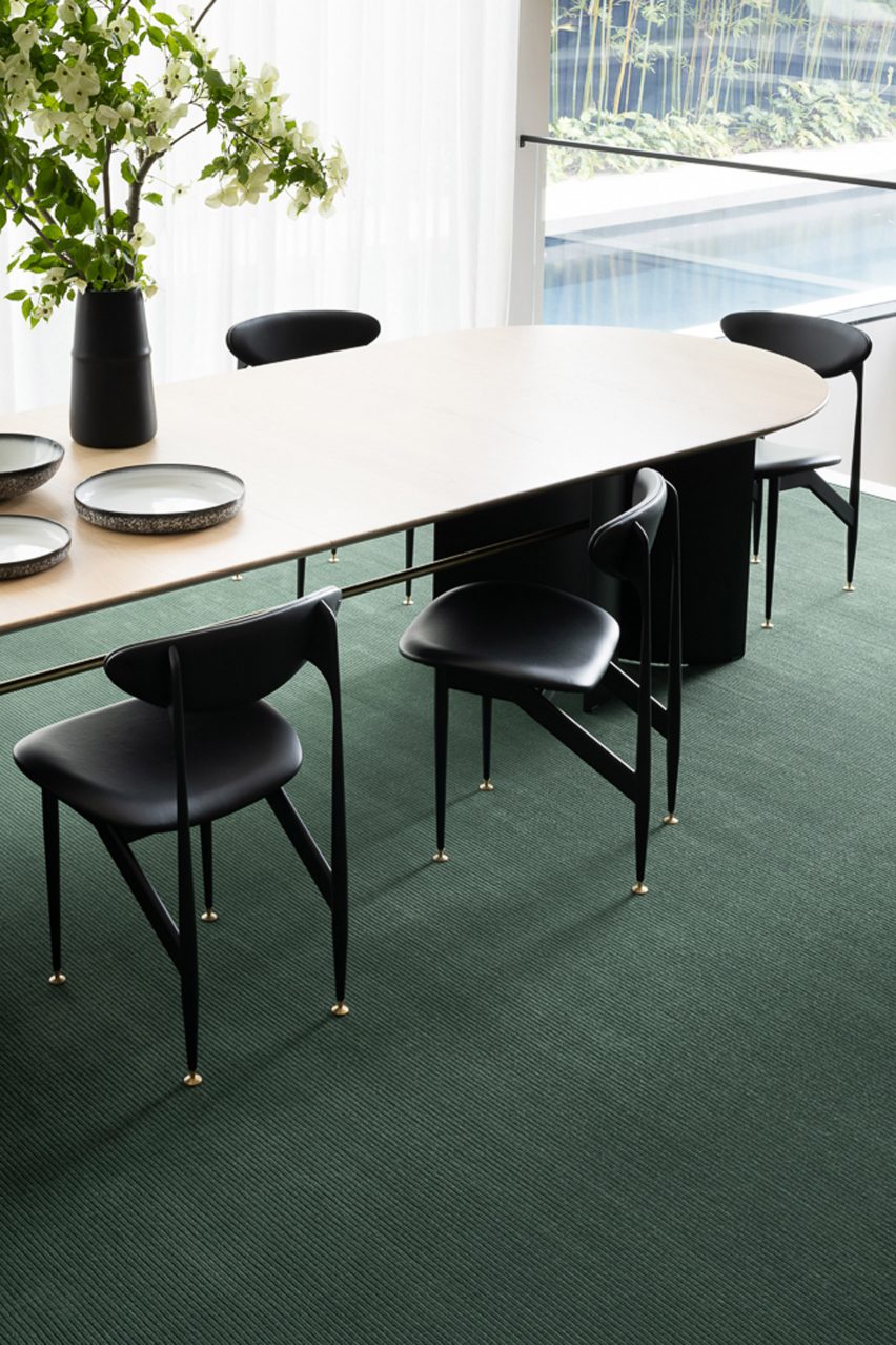 A photograph of a green carpet by Signature Floors