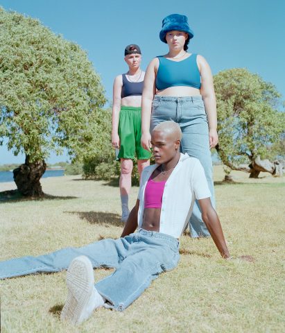 People are pictured wearing the binders with denim