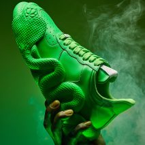 Green Cobras trainers in a cloud of smoke