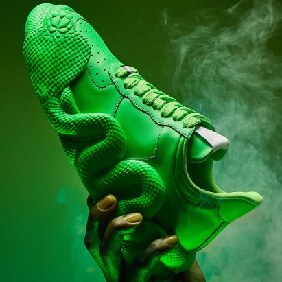 Green Cobras trainers in a cloud of smoke