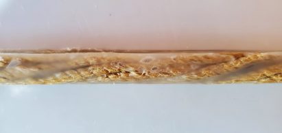Twisted hemp fibres encased in thermoplastic to make a reinforcing bar
