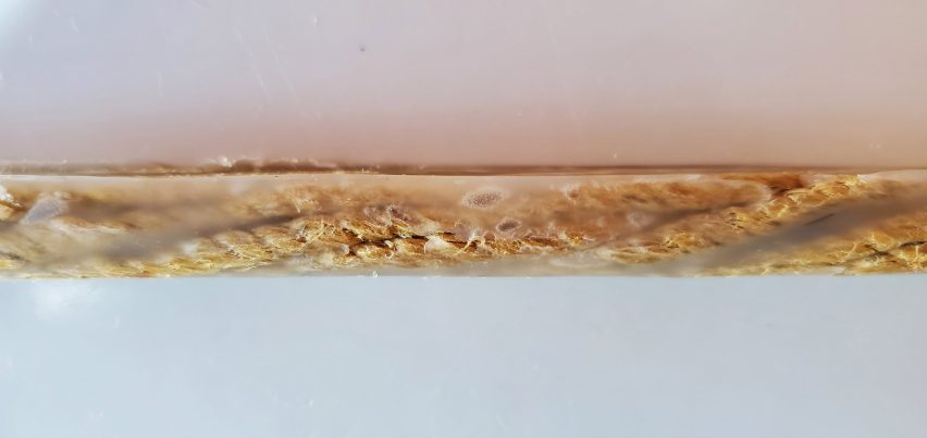 Twisted hemp fibres encased in thermoplastic to make a reinforcing bar