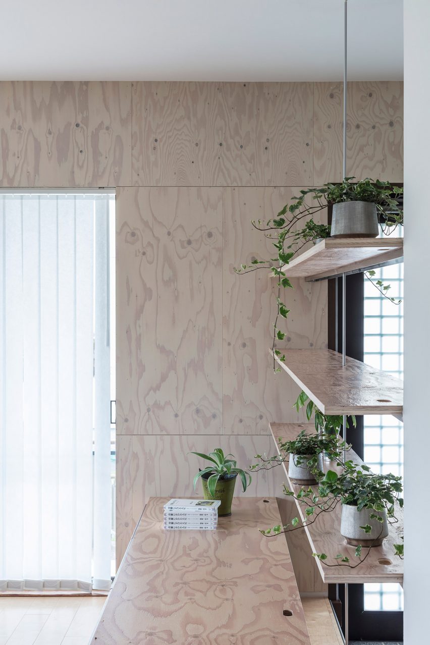 Plywood walls and shelves in House in Honjo by Jorge Almazán Architects