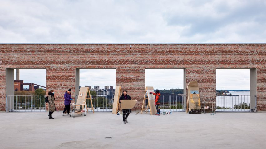 Students are painting on the roof