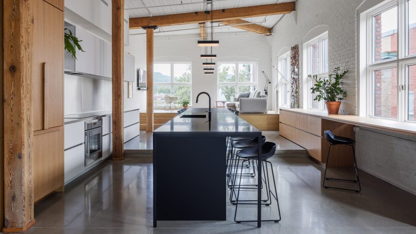 La Firme reorganises centuries-old Montreal loft with contemporary finishes