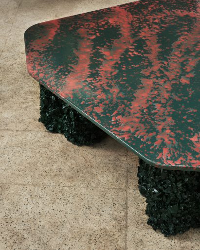 Red and black coffee table with enamel top and rubber legs by CAN