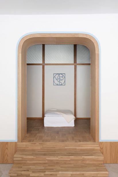 Arched wall with wooden door frame