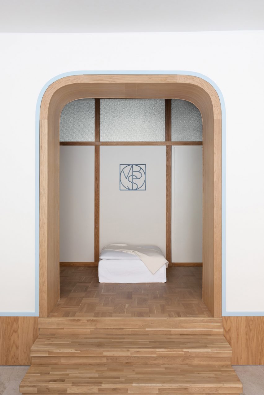 Arched wall with wooden door frame