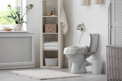 A bathroom with a white toilet