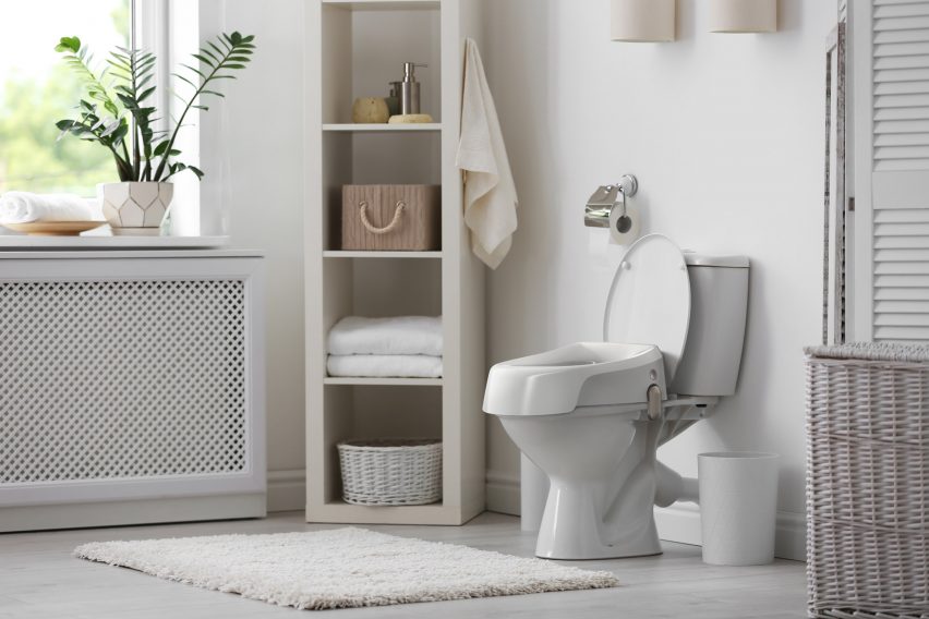 A bathroom with a white toilet