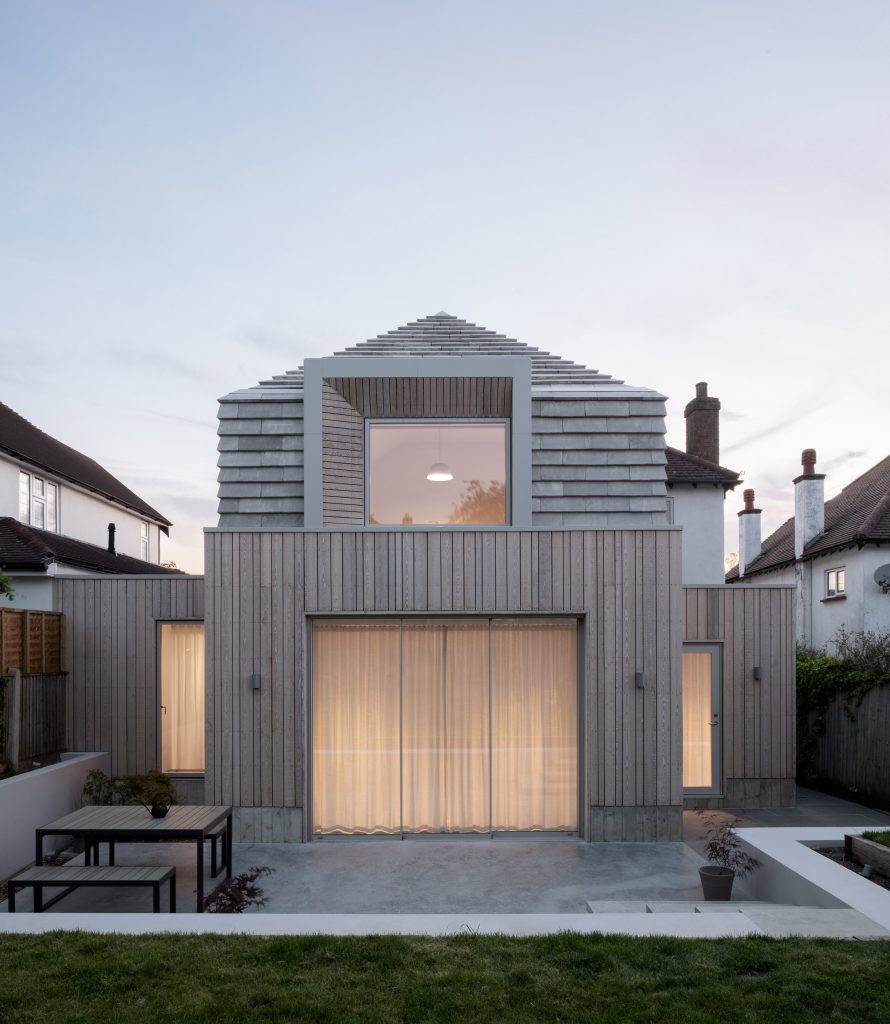 Hipped House is pictured at dusk