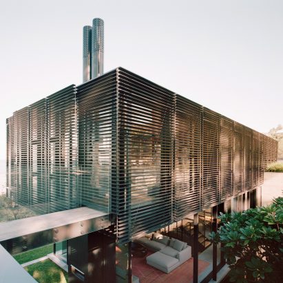 Bilgola Beach House is wrapped in black shutters