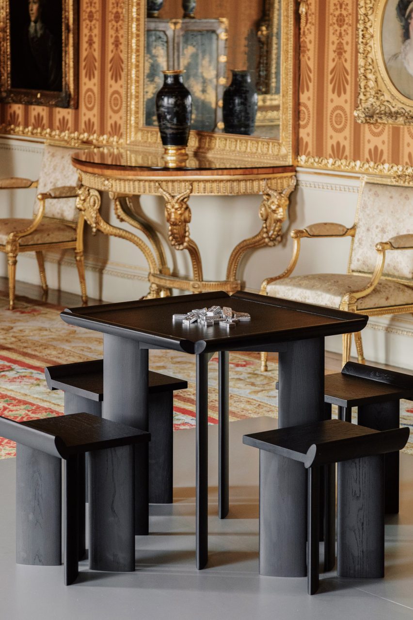 Four stools arranged around Open Code gaming table by Mac Collins at Harewood Biennial