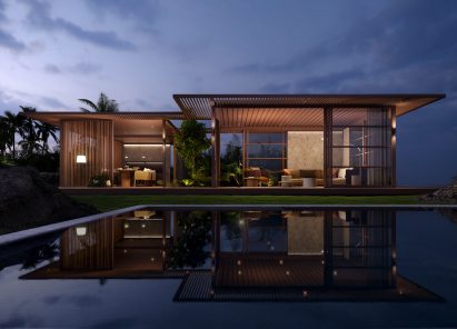 Pavilion H outdoor space by Kettal with ambient lighting at night and a pool in the foreground
