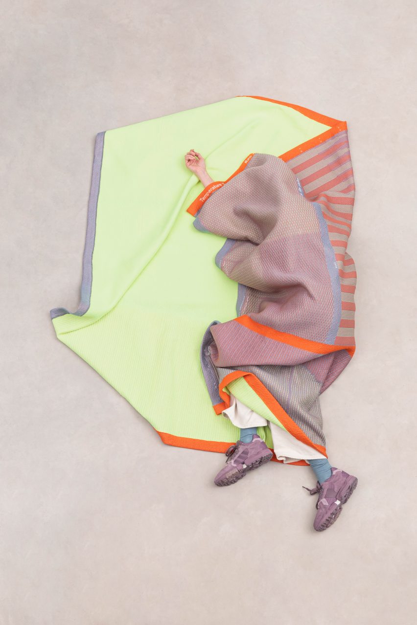 Person wrapped up in Raw Color's Temperature Textiles blanket