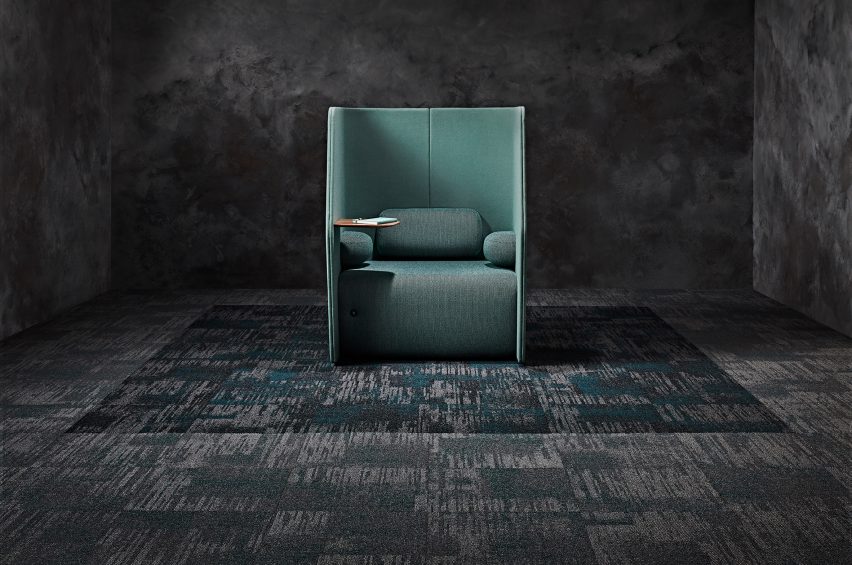 A photograph of Raw Elements carpet tiles by Signature Floors, which reference grey, black and grey rocks