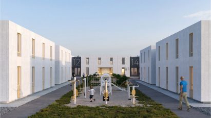 Render of two-storey buildings arranged around playground in Re:Ukraine refugee village