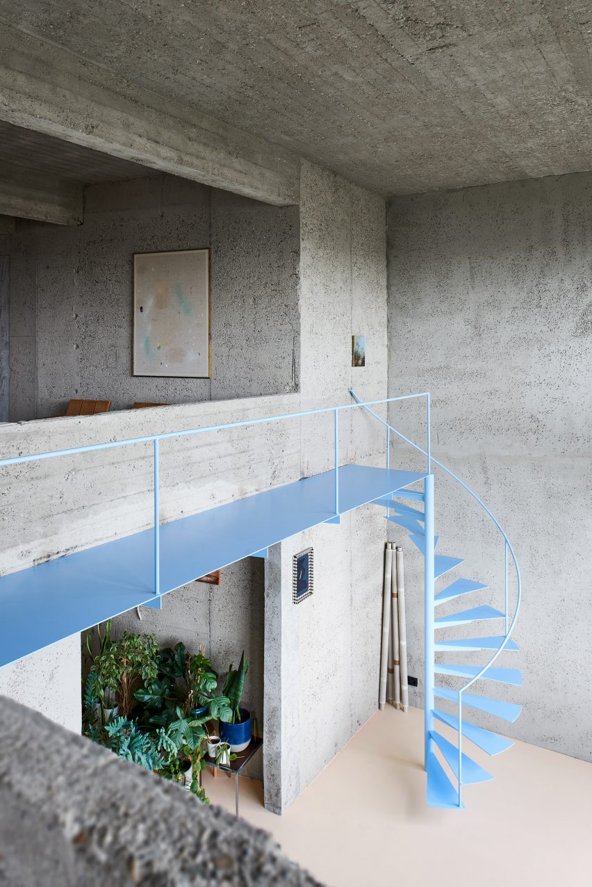 Spiral staircase in concrete apartment