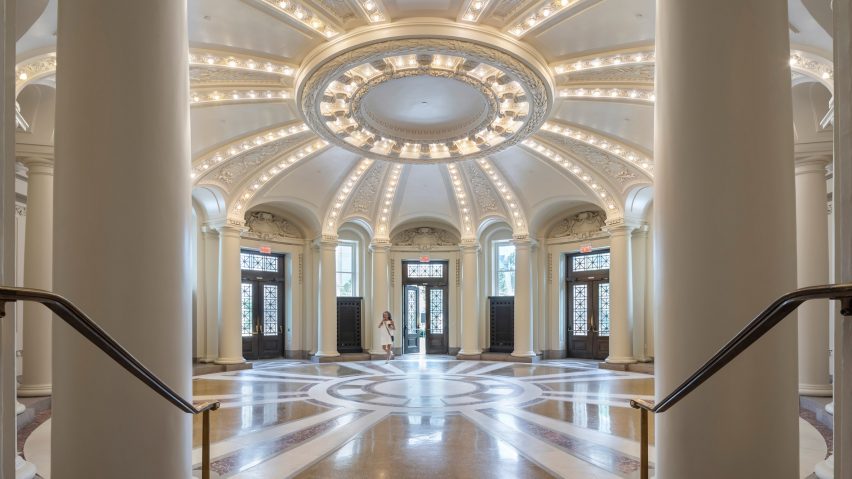 A white atroum with columns by RAMSA