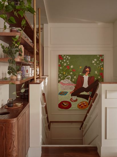 A cream coloured deli interior with stairs