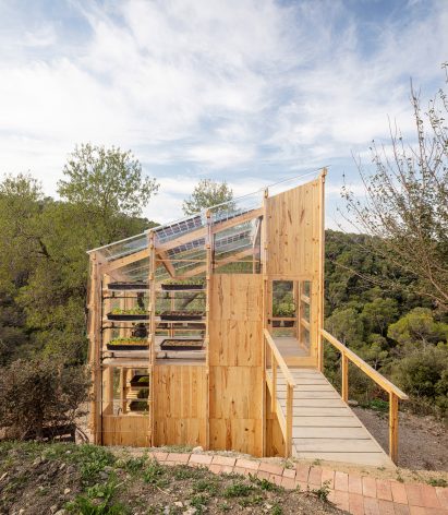 Front elevation of the Solar Greenhouse that is accessed via a footbridge