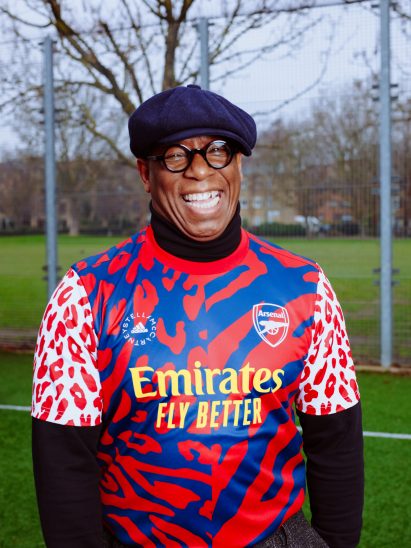 Ian Wright wearing a colourful football jersey