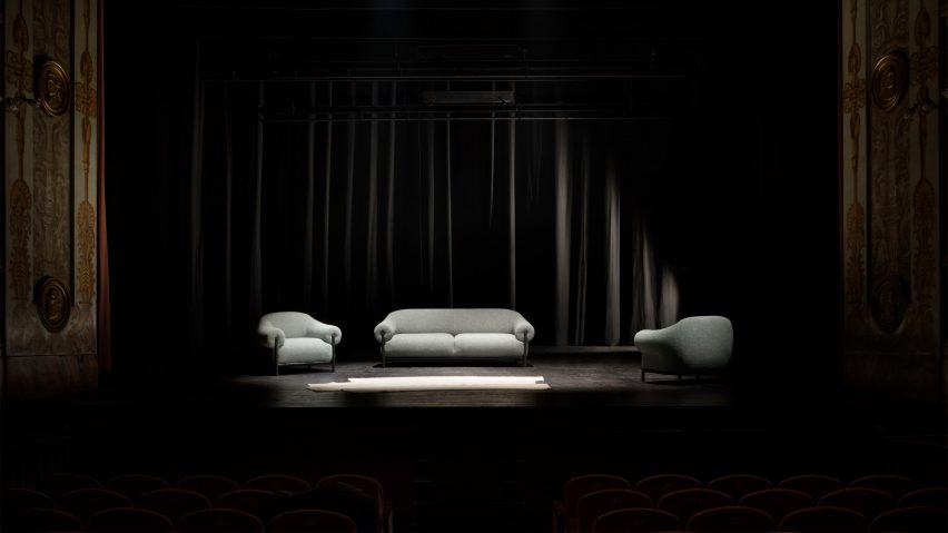 Fender sofa and two armchairs on a theatre stage with spot lighting