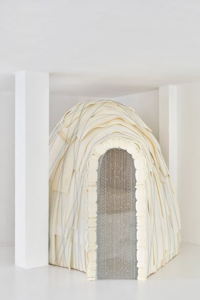 Steel-curtained entryway to kid's bedroom by Takk in bright white warehouse