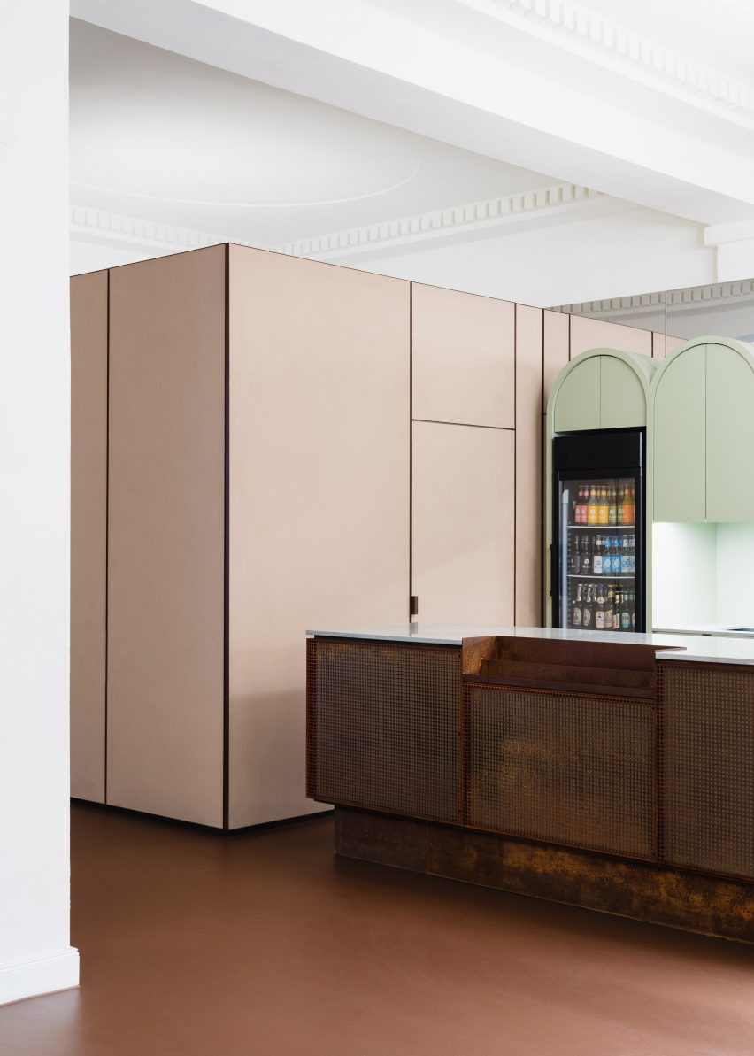 Cork-clad cabinets in cinema foyer