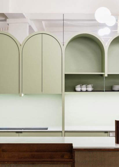 Pistachio-green arches in cinema bar