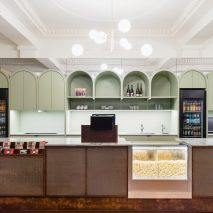 Pastel-coloured arches in Berlin cinema foyer